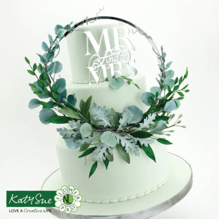 wedding cake decorated with foliage