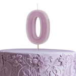 pastel purple number 0 candle on a cake