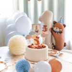 1 year old birthday candle teddy bear on a cake