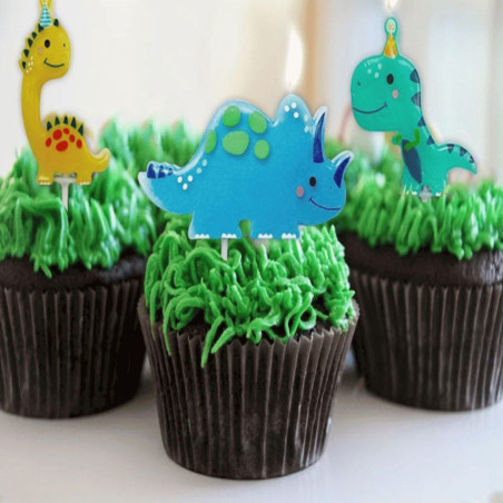 dinosaur candles on cupcakes