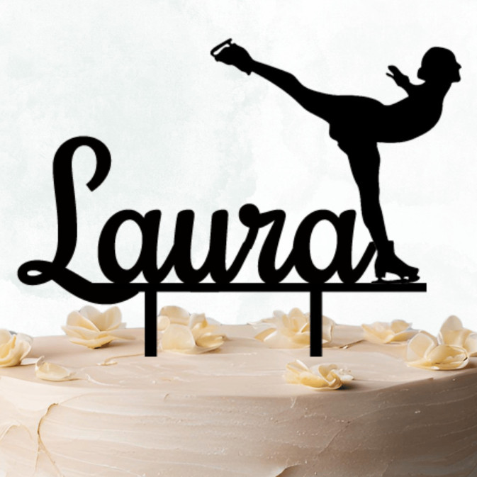 Figure skater cake topper on cake