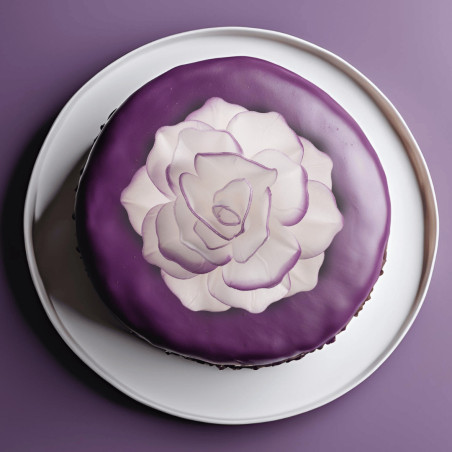 White wafer flower and purple outline on cake design