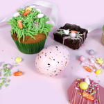 cupcake decorated with Happy Easter sprinkles