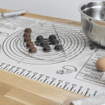 Non-stick graduated baking mat for rolling, kneading, working with chocolate, cooked sugar, and shaping cookies