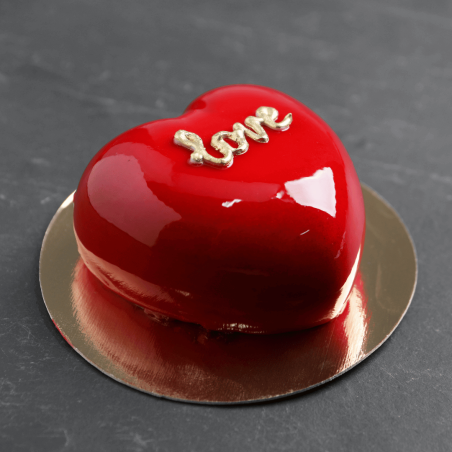 red icing on a heart-shaped cake
