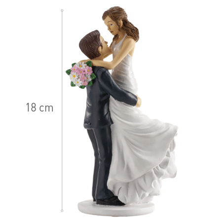 Wedding cake topper of bride and groom in arms, 18cm
