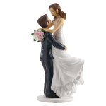 Wedding cake figurine of bride and groom in arms