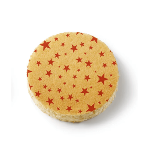 sponge cake decorated with red Christmas star patterns
