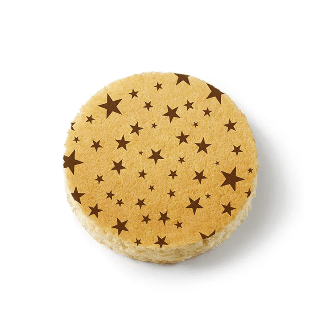 sponge cake decorated with brown star patterns